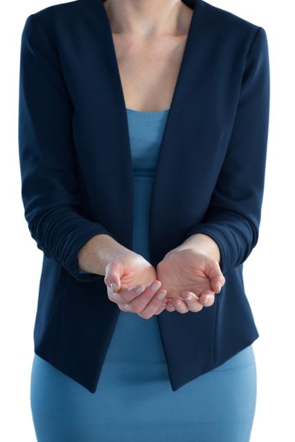 Mid section of businesswoman standing with hands cupped against white backgorund
