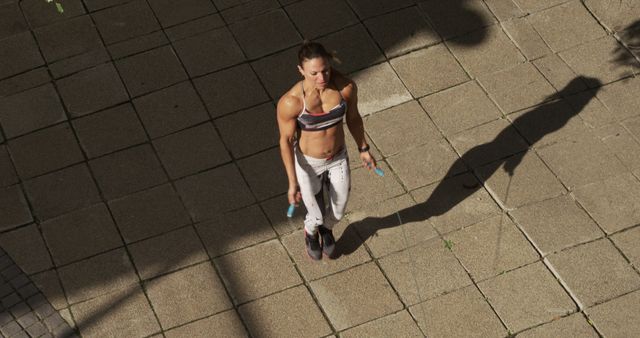 Fit caucasian woman skipping rope, exercising in city with copy space - Download Free Stock Photos Pikwizard.com