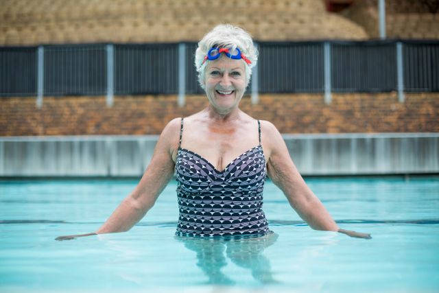 Portrait of senior woman swimming in pool - Download Free Stock Photos Pikwizard.com