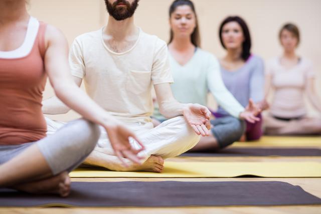 Group of people sitting in lotus position - Download Free Stock Photos Pikwizard.com