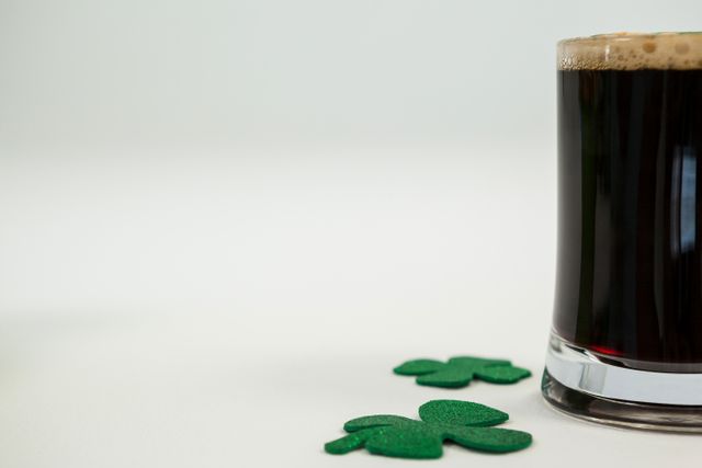 Mug of black beer and shamrock for St Patricks Day - Download Free Stock Photos Pikwizard.com