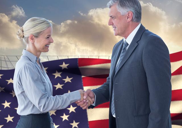 Digital composition of business executives shaking hands against american flag in background