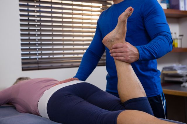Physiotherapist giving leg massage to a woman - Download Free Stock Photos Pikwizard.com