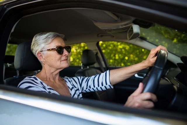 Senior woman driving car - Download Free Stock Photos Pikwizard.com