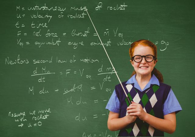 Portrait of a smiling girl standing in front of chalkboard - Download Free Stock Photos Pikwizard.com