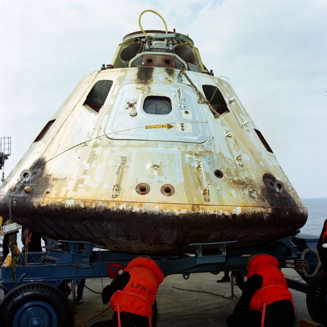 S69-20239 (13 March 1969) --- Close-up view of the Apollo 9 Command Module (CM) as it sets on dolly on the deck of the USS Guadalcanal just after being hoisted from the water. The Apollo 9 spacecraft, with astronauts James A. McDivitt, David R. Scott, and Russell L. Schweickart aboard, splashed down at 12:00:53 p.m. (EST), March 13, 1969, only 4.5 nautical miles from the aircraft carrier to conclude a successful 10-day Earth-orbital mission in space.