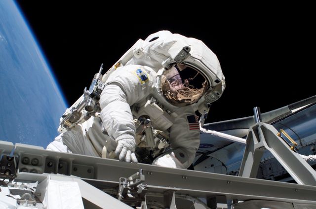 Stefanyshyn-Piper performs first EVA during STS-115 / Expedition 13 Joint Operations - Download Free Stock Photos Pikwizard.com
