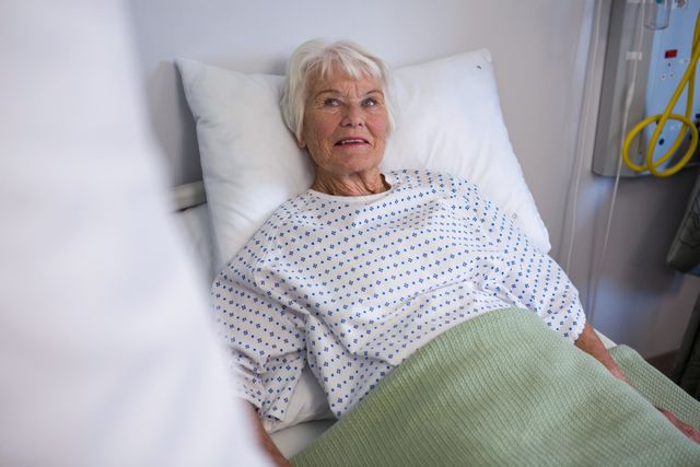 Senior patient lying on bed - Download Free Stock Photos Pikwizard.com