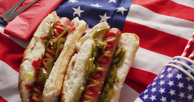 Image of hot dogs with mustard and ketchup over flag of usa. food, cuisine and catering ingredients.