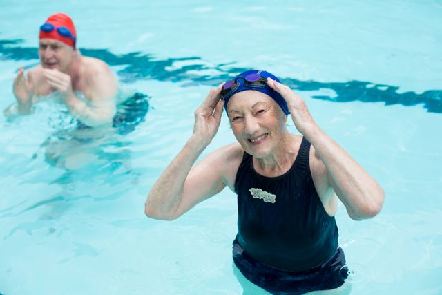 Senior man and woman swimming in pool - Download Free Stock Photos Pikwizard.com