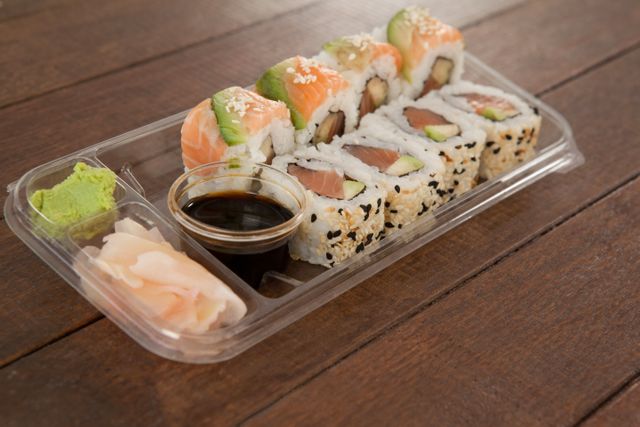 Set of assorted sushi served in a plastic box - Download Free Stock Photos Pikwizard.com