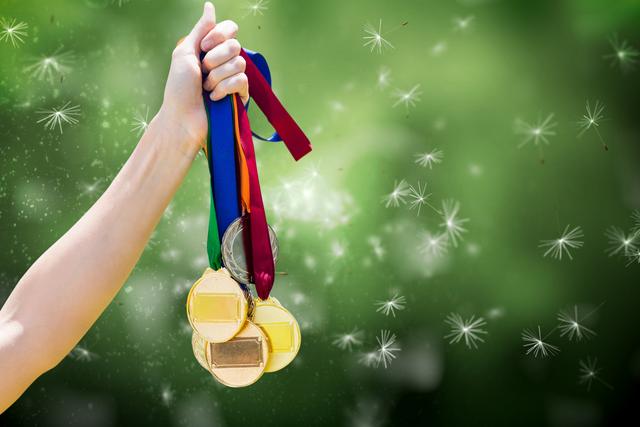 hand holding medals over nature background - Download Free Stock Photos Pikwizard.com