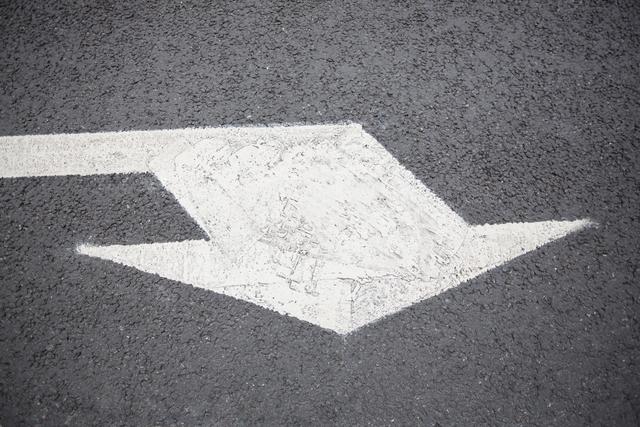 Arrow sign on road surface - Download Free Stock Photos Pikwizard.com