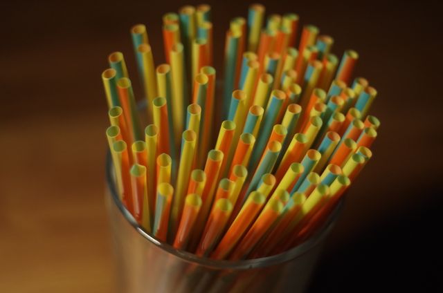 Colorful Plastic Straw on a Glass Container - Download Free Stock Photos Pikwizard.com