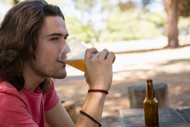 Man drinking beer from disposable glass - Download Free Stock Photos Pikwizard.com