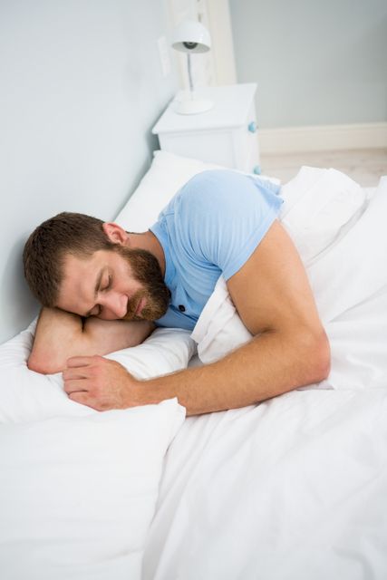 Man sleeping on bed - Download Free Stock Photos Pikwizard.com