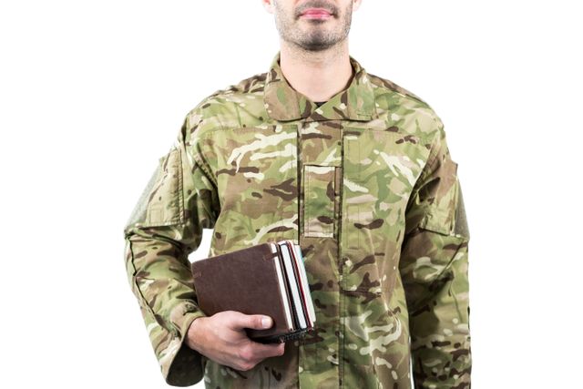Mid section of soldier holding books - Download Free Stock Photos Pikwizard.com