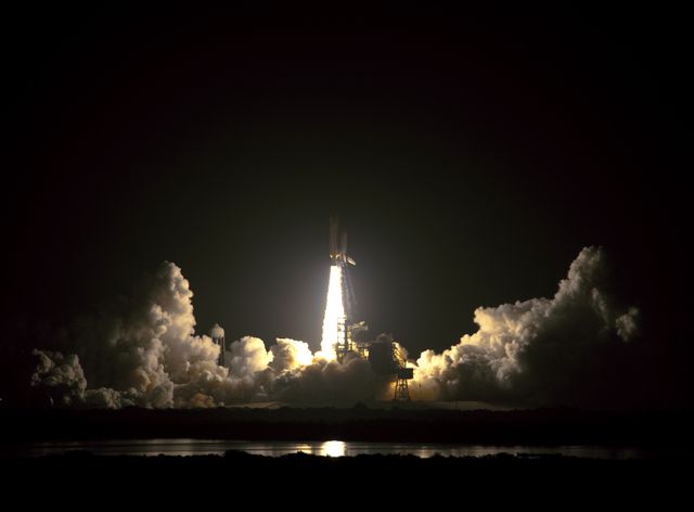 CAPE CANAVERAL, Fla. –  Rising on a column of fire, space shuttle Discovery hurtles toward space after liftoff from Launch Pad 39A at NASA's Kennedy Space Center in Florida.  Liftoff on the STS-128 mission was on time at 11:59 p.m. EDT. The first launch attempt on Aug. 24 was postponed due to unfavorable weather conditions.  The second attempt on Aug. 25 also was postponed due to an issue with a valve in space shuttle Discovery's main propulsion system.  The STS-128 mission is the 30th International Space Station assembly flight and the 128th space shuttle flight. The 13-day mission will deliver more than 7 tons of supplies, science racks and equipment, as well as additional environmental hardware to sustain six crew members on the International Space Station. The equipment includes a freezer to store research samples, a new sleeping compartment and the COLBERT treadmill.  Photo credit: NASA/Jeff Wolfe