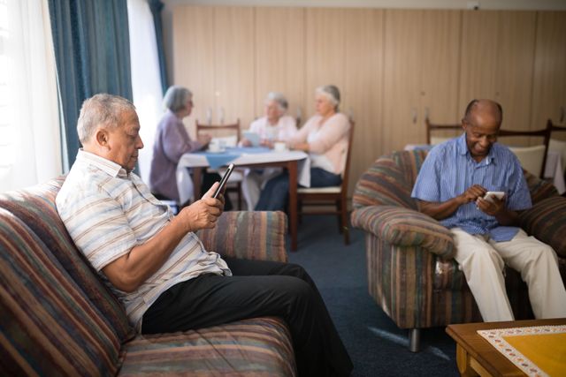 Senior men using mobile phone at nursing home - Download Free Stock Photos Pikwizard.com