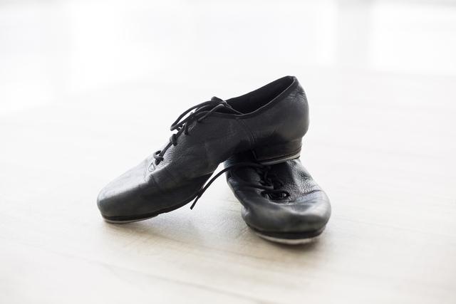 Dancing shoes on wooden floor - Download Free Stock Photos Pikwizard.com