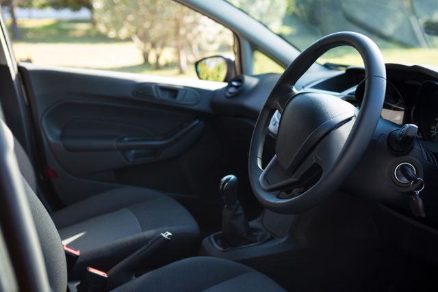Car interior with steering wheel - Download Free Stock Photos Pikwizard.com