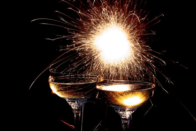 two glasses of wine with a sparkler - Download Free Stock Photos Pikwizard.com