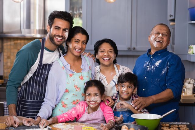 Portrait of cheerful multi-generation family enjoying in kitchen - Download Free Stock Photos Pikwizard.com