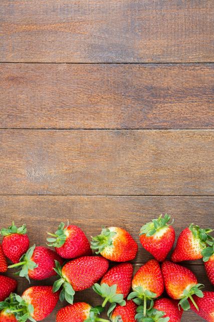 Fresh strawberries on wooden board - Download Free Stock Photos Pikwizard.com