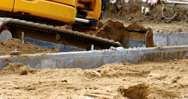 Excavator leveling soil at construction site - Download Free Stock Photos Pikwizard.com
