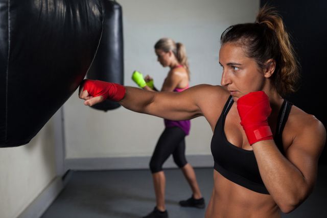 Women practicing boxing in fitness studio - Download Free Stock Photos Pikwizard.com