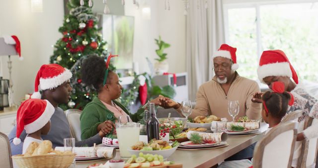 African american family praying before christmas dinner - Download Free Stock Photos Pikwizard.com