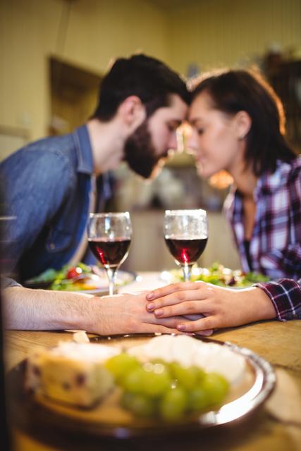 Couple romancing while having wine and breakfast - Download Free Stock Photos Pikwizard.com