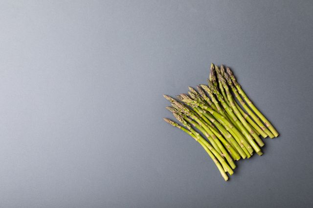 Overhead view of asparagus arranged on gray background, copy space - Download Free Stock Photos Pikwizard.com