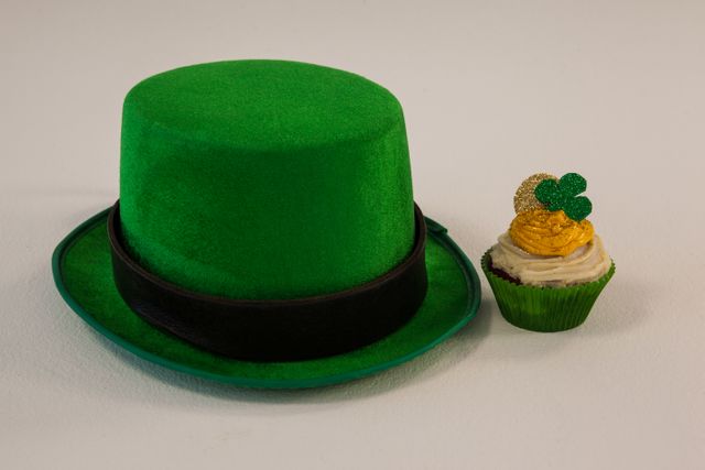 St Patricks Day leprechaun hat with shamrock on cupcake - Download Free Stock Photos Pikwizard.com
