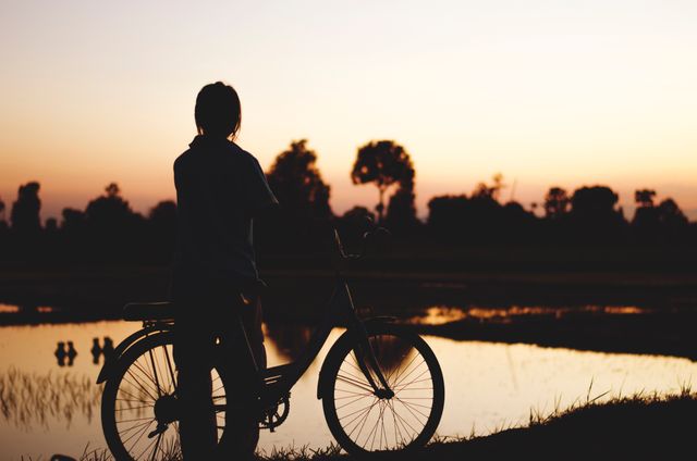 Silhouette Man Riding Bicycle at Sunset - Download Free Stock Photos Pikwizard.com