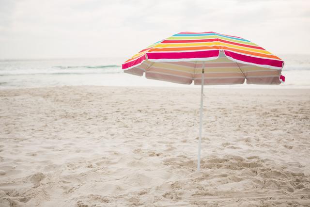 Beach umbrella at tropical sand beach - Download Free Stock Photos Pikwizard.com