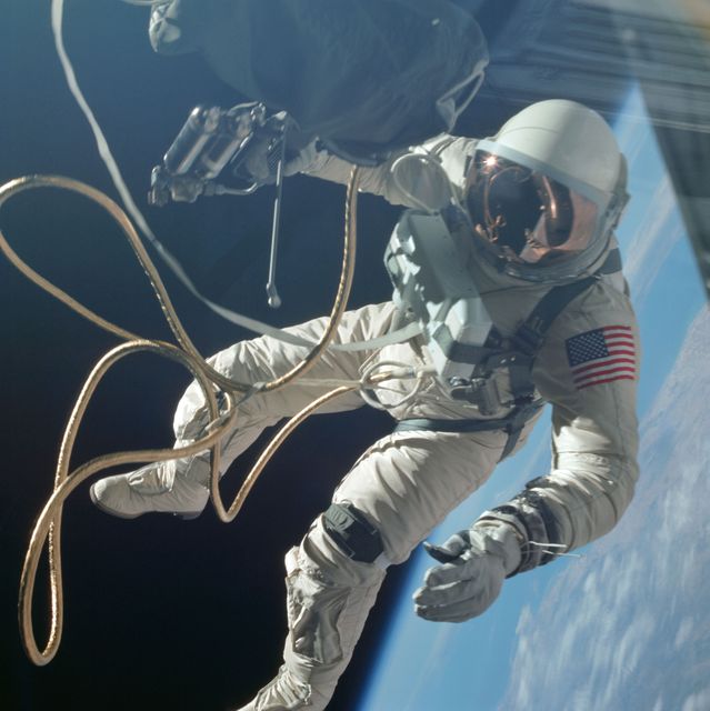 S65-30433 (3 June 1965) --- Astronaut Edward H. White II, pilot of the Gemini IV four-day Earth-orbital mission, floats in the zero gravity of space outside the Gemini IV spacecraft. White wears a specially designed spacesuit; and the visor of the helmet is gold plated to protect him against the unfiltered rays of the sun. He wears an emergency oxygen pack, also. He is secured to the spacecraft by a 25-feet umbilical line and a 23-feet tether line, both wrapped in gold tape to form one cord. In his right hand is a Hand-Held Self-Maneuvering Unit (HHSMU) with which he controls his movements in space.  Astronaut James A. McDivitt, command pilot of the mission, remained inside the spacecraft. Photo credit: NASA    EDITOR'S NOTE: Astronaut White died in the Apollo/Saturn 204 fire at Cape Kennedy on Jan. 27, 1967.
