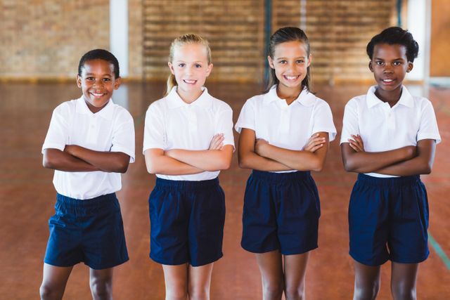 Portrait of school kids standing with arms crossed - Download Free Stock Photos Pikwizard.com
