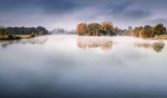 Lake With Fog Under Dark Blue Sky Photography - Download Free Stock Photos Pikwizard.com
