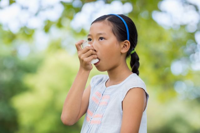 Girl using an asthma inhaler - Download Free Stock Photos Pikwizard.com