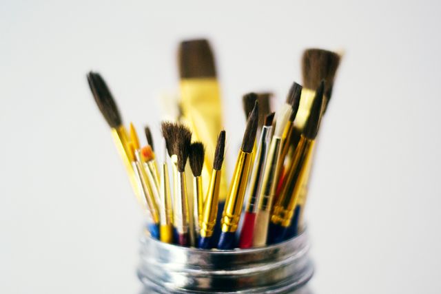 a jar filled with paint brushes - Download Free Stock Photos Pikwizard.com
