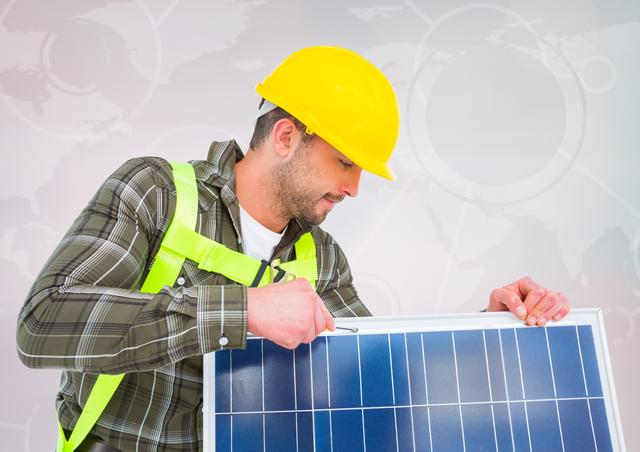 Man fixing solar panel against map background - Download Free Stock Photos Pikwizard.com