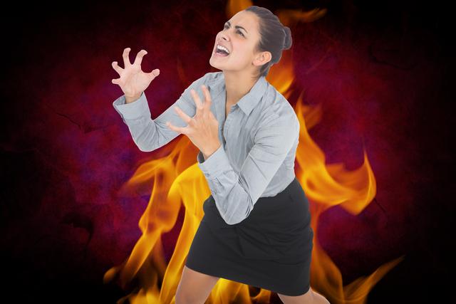 Digital composite image of aggressive businesswoman with fire - Download Free Stock Photos Pikwizard.com