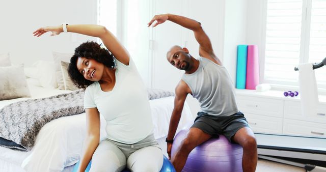 Healthy Lifestyle: Couple Exercising Together at Home Gym