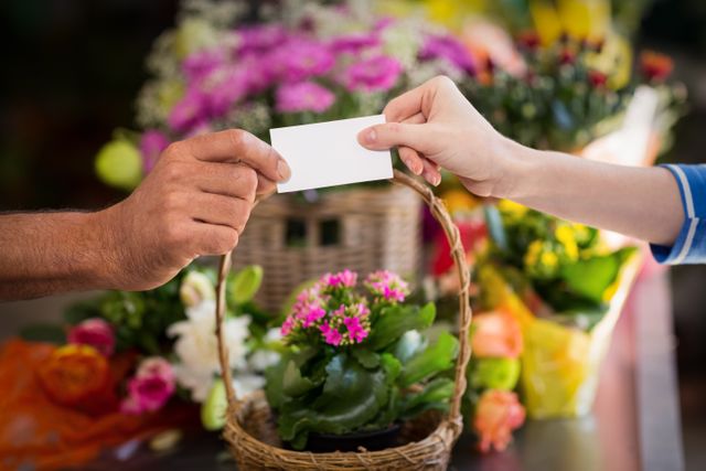 Florist giving visiting card to customer - Download Free Stock Photos Pikwizard.com