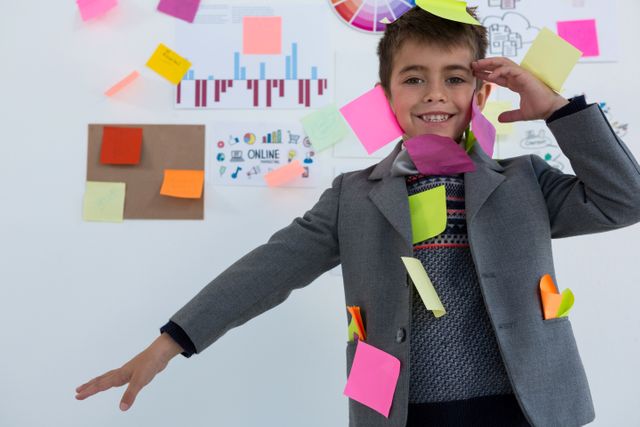 Boy as business executive with sticky notes on his body - Download Free Stock Photos Pikwizard.com