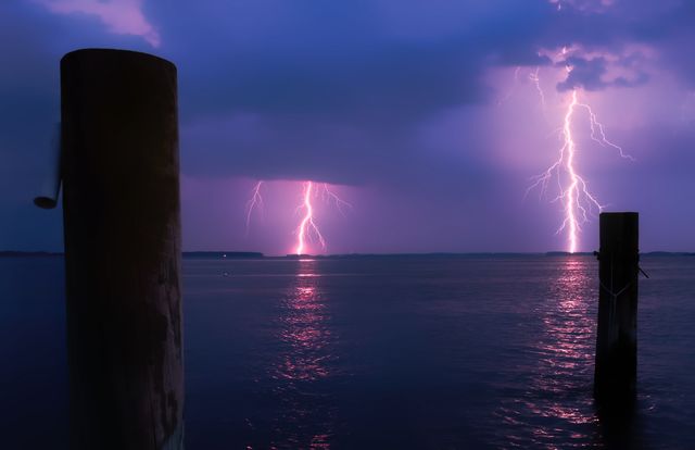 Lightning over Sea Against Storm Clouds - Download Free Stock Photos Pikwizard.com