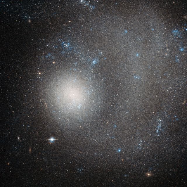 Hubble Sees a Dwarf Galaxy Shaped by a Grand Design - Download Free Stock Photos Pikwizard.com