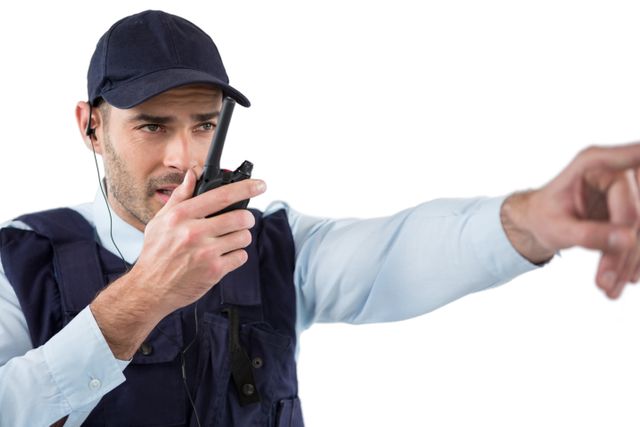 Security officer talking on walkie-talkie - Download Free Stock Photos Pikwizard.com