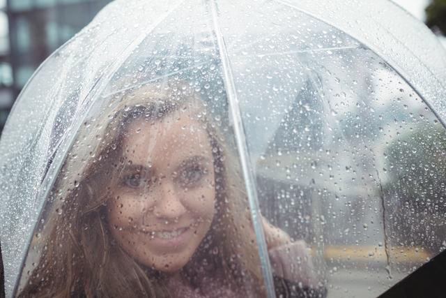 Beautiful woman holding an umbrella - Download Free Stock Photos Pikwizard.com